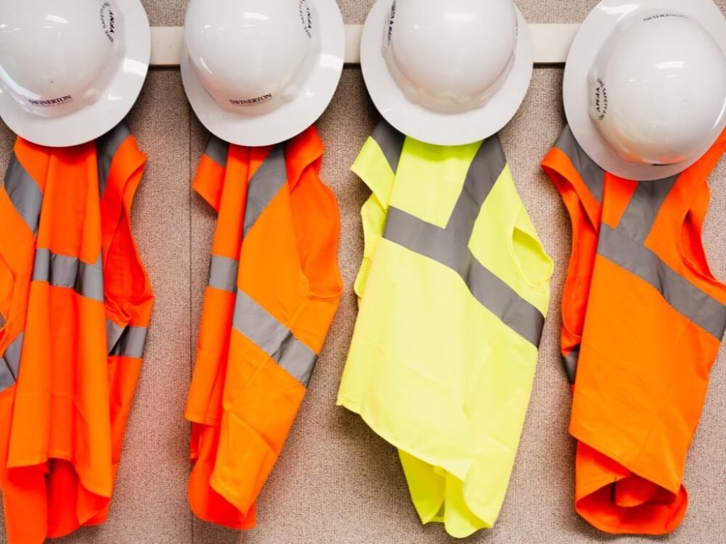 construction hard hats and vests.